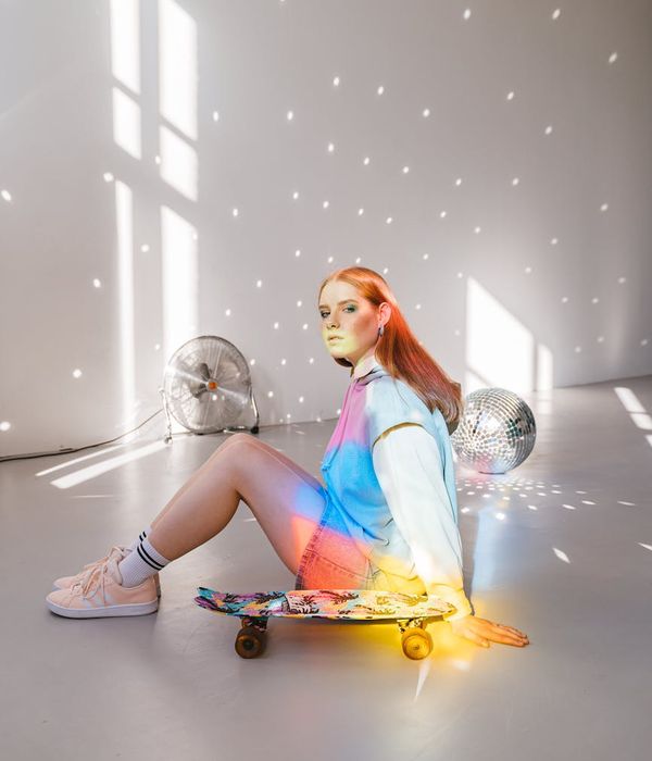 Woman feeling energetic and balanced in a modern space.